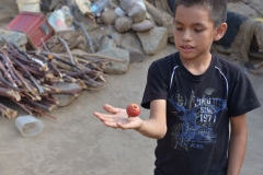 Local-kid-showing-us-how-to-spin-a-top