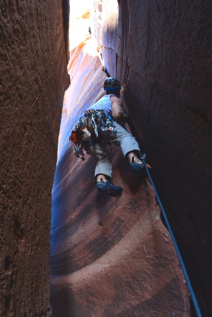 Climbing inside a chimney at Indian Creek