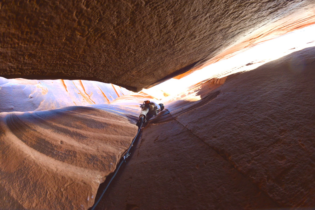 Nick Scott climbing inside a chimney at Indian Creek